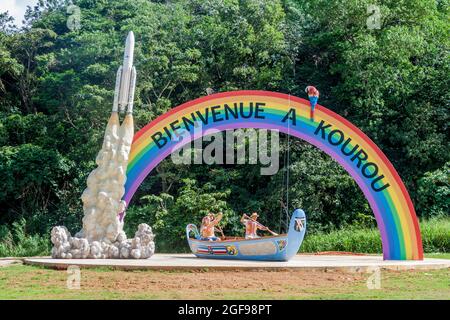 KOUROU, FRENCH GUIANA - AUGUST 3, 2015: Welcome rainbow arch with space rocket Ariane 5 at the road to Kourou, French Guiana. Stock Photo