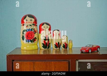 Colourful traditioal dressed Russian dolls , placed on a showcase. Stock Photo