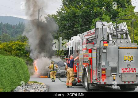 Fire department responds to GMC Yukon SUV on fire, District of North Vancouver, British Columbia, Canada Stock Photo