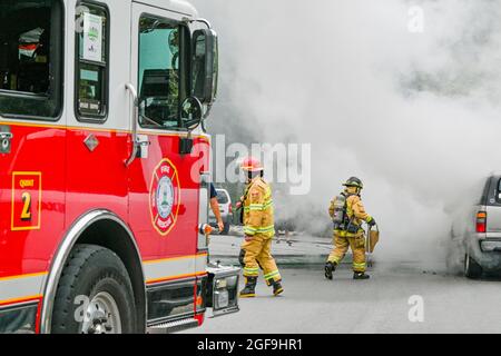 Fire department responds to GMC Yukon SUV on fire, District of North Vancouver, British Columbia, Canada Stock Photo