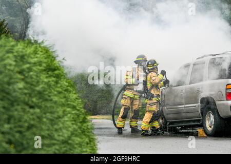 Fire department responds to GMC Yukon SUV on fire, District of North Vancouver, British Columbia, Canada Stock Photo