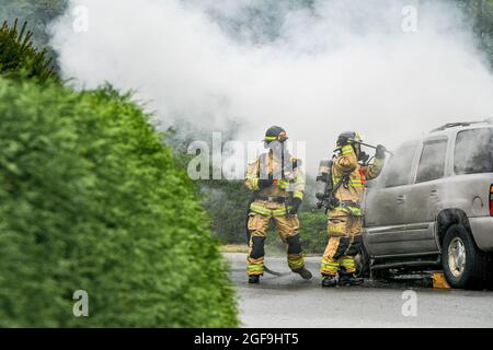 Fire department responds to GMC Yukon SUV on fire, District of North Vancouver, British Columbia, Canada Stock Photo