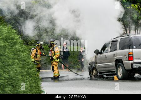 Fire department responds to GMC Yukon SUV on fire, District of North Vancouver, British Columbia, Canada Stock Photo