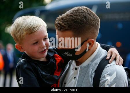 Lucas Digne #12 of Everton spends time with a young Everton fan as