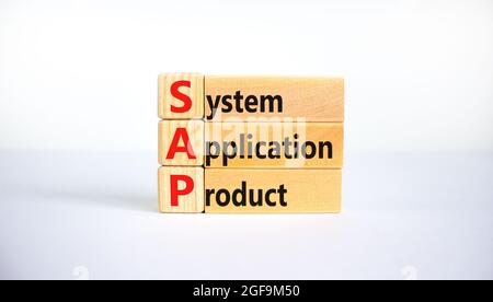 SAP, system, application, product symbol. Wooden blocks with words SAP, system, application, product. Beautiful white background, copy space. Business Stock Photo