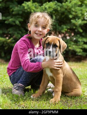 Portrait of little girl with her dog Stock Photo