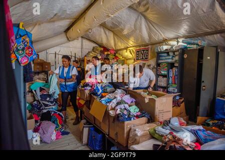 Al Udeied Air Base, Qatar. 22nd Aug, 2021. U.S. Air Force airmen working with the USO gather donations in preparation for the arrival of Afghan refugees in support of Operation Allies Refuge August 22, 2021 at Al Udeid Air Base, Qatar. Credit: Planetpix/Alamy Live News Stock Photo