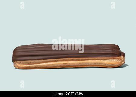 Chocolate eclair on light blue background isolated Stock Photo