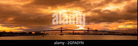 Sunset on the Mactan Channel in Cebu with the Marcelo B. Fernan Bridge, Philippines. Five photos were combined for this panorama image. Stock Photo