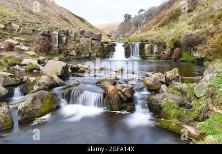 Waterfalls cascading over rocks in the River Dane, near the Three Shires Head where the counties of Cheshire, Derbyshire and Staffordshire meet. Stock Photo