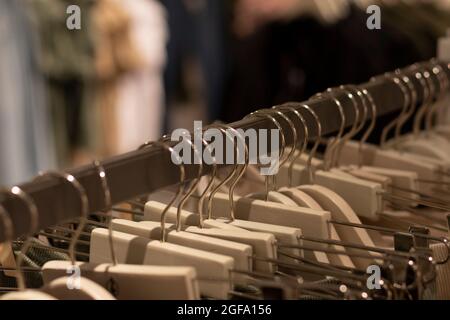 a clothes hanger with their respective hangers and clothes. Front view. Fashion concept Stock Photo