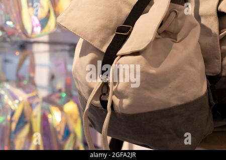 Backpacks hanging on a shelf in a store. Transportation concept. Stock Photo