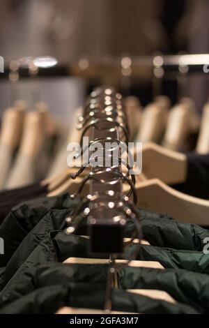 a clothes hanger with their respective hangers and clothes. Front view. Fashion concept Stock Photo