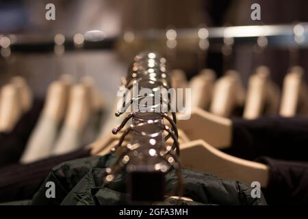 a clothes hanger with their respective hangers and clothes. Front view. Fashion concept Stock Photo