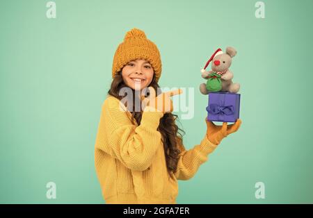 Shopaholic. christmas presents online. get ready for xmas. happy new 2020 year. rat symbol of the year. small happy girl hold mouse toy. kid knitted Stock Photo