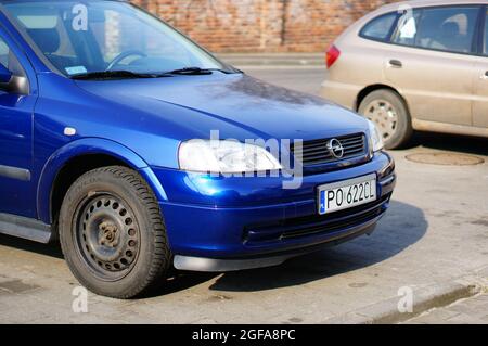 POZNAN, POLAND - Feb 23, 2015: A parked blue Opel car in a parking lot Stock Photo