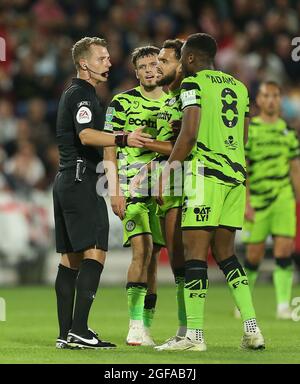 Forest Green Rovers' Ebou Adams argues after receiving a red card from referee Will Finnie during the Carabao Cup second round match at Brentford Community Stadium, London. Picture date: Tuesday August 24, 2021. Stock Photo