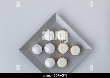 Tartlets on a stylish gray plate in a restaurant, on-site catering, a delicious and stylish dessert Stock Photo