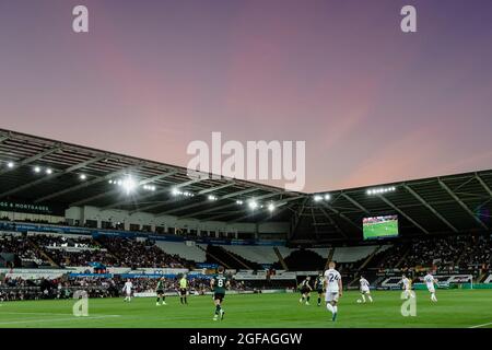 SWANSEA, WALES - 24 AUGUST 2021: The sun sets during the Carabao Cup second round fixture between Swansea City & Plymouth Argyle at The Liberty Stadium, Tuesday 24th August 2021. Credit: John Smith/Alamy Live News Stock Photo