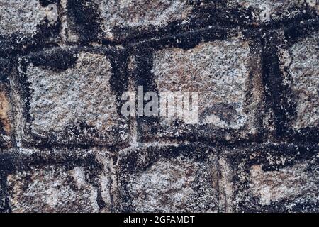Old Temple wall. Rectangular cut out marble granite brick real surface stone with cement. Pattern gray color rustic texture background. Design website Stock Photo