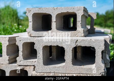 stacked cinder blocks laying so that the other side is visible through the grid Stock Photo