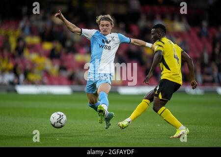 Watford, UK. 24th Aug, 2021. Conor Gallagher (on loan from Chelsea) of Crystal Palace & Peter Etebo (on loan from Stoke City) of Watford during the Carabao Cup match between Watford and Crystal Palace at Vicarage Road, Watford, England on 24 August 2021. Photo by Andy Rowland. Credit: PRiME Media Images/Alamy Live News Stock Photo