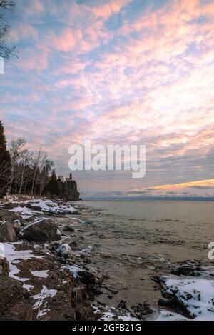 Sunrise at Split Rock Lighthouse on a cold, January morning along Lake Superior. Two Harbors, Minnesota, USA. Stock Photo