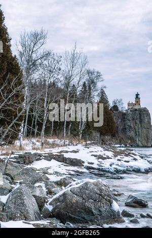 Sunrise at Split Rock Lighthouse on a cold, January morning along Lake Superior. Two Harbors, Minnesota, USA. Stock Photo