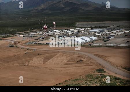 Area photo of the progression of Dona Ana Housing Area near Fort Bliss, Texas, Aug. 22, 2021. The Department of Defense, in support of the Department of State, is providing transportation and temporary housing in support of Operation Allies Refuge. This initiative follows through on America's commitment to Afghan citizens who have helped the United States, and provides them essential support at secure locations outside Afghanistan. (U.S. Army photo by Spc. Elijah Ingram) Stock Photo