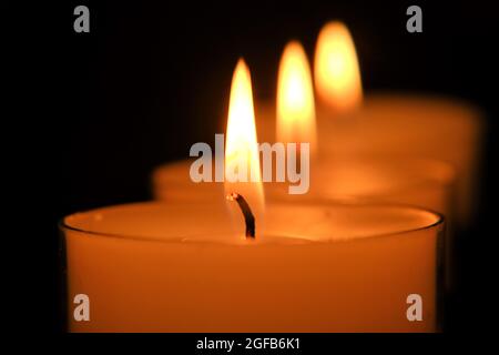 Candle flame. white candles Set. Burning candles in the dark Stock Photo