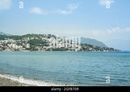 Picture of Herceg Novi, Montenegro,  seen from a beach on the adriatic sea on the foreground. Herceg Novi is a coastal town in Montenegro located at t Stock Photo