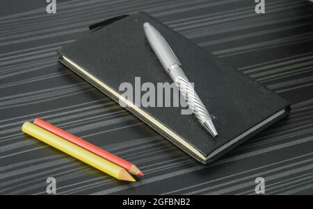 Pen and notebook on office table. Table top view. Corporate business background. Stock Photo