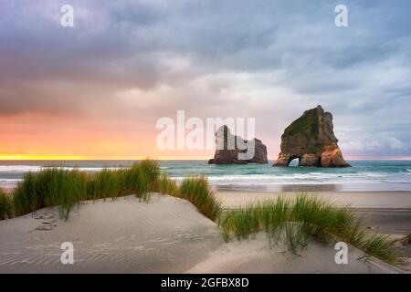Sand dunes and Archway Islands, Wharariki Beach, Puponga, Golden Bay, South Island, New Zealand Stock Photo
