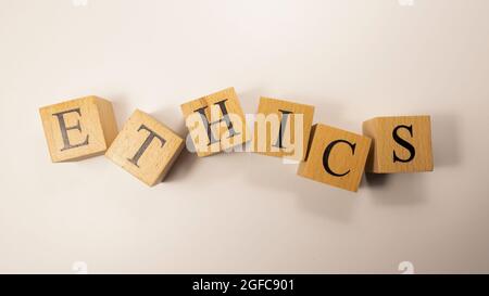 The word Ethics was created from wooden cubes. Rules and morals. close-up. Stock Photo