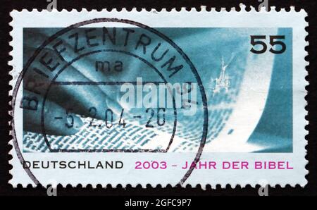 GERMANY - CIRCA 2003: a stamp printed in the Germany shows Bible and Hand, Bible Year, circa 2003 Stock Photo