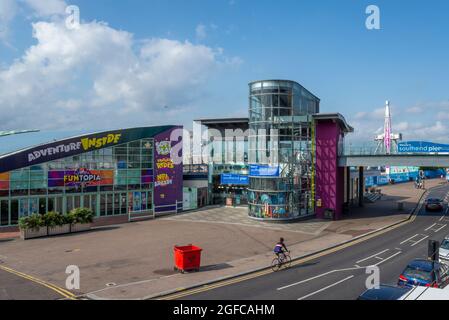 Entrance to Southend Pier and Adventure Island inside attractions early morning. Quiet seafront in Southend on Sea, Essex, UK before crowds visit Stock Photo