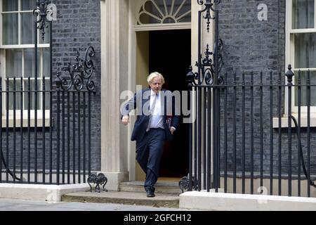 British Prime Minister Boris Johnson leaving 10 Downing Street on his way to a virtual G7 conference to discuss the situation in Afghanistan. 24th Aug Stock Photo