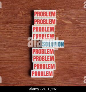 Concept of problem solving. Look for the solution inside the problem. Top view of wooden tiles with text PROBLEM and SOLUTION Stock Photo