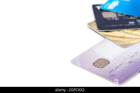 Selective focus of group of multi colored bank credit cards on white background. Stock Photo