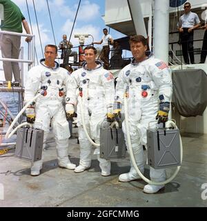 (5 Aug. 1968) --- The prime crew of the first manned Apollo space mission, Apollo 7, stands on the deck of the NASA Motor Vessel Retriever after suiting up for water egress training in the Gulf of Mexico. Left to right, are astronauts Walter Cunningham, Donn F. Eisele, and Walter M. Schirra Jr Stock Photo
