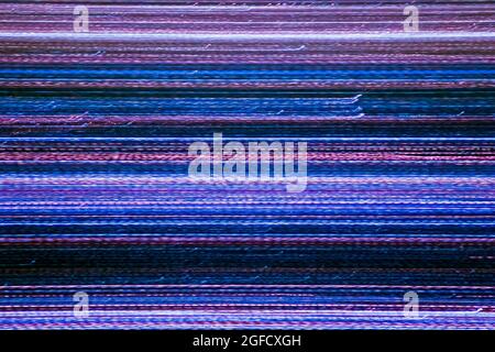 Scratchy streaks of banded light transmitting data through the cosmos Stock Photo