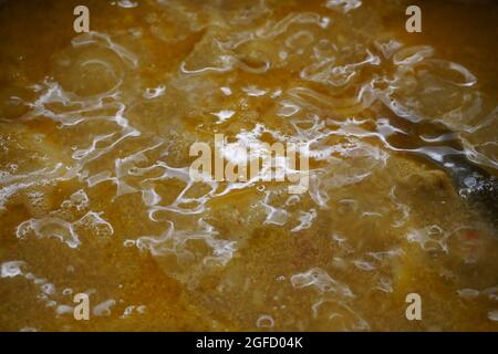 Closeup of unknown simmering stock Stock Photo