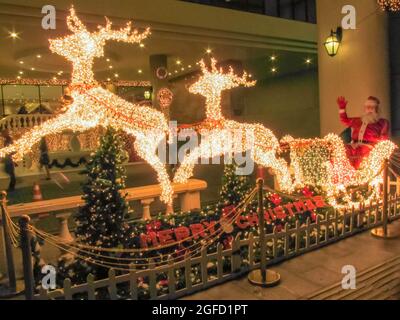 Santa Claus rides on a sleigh pulled by reindeer Stock Photo