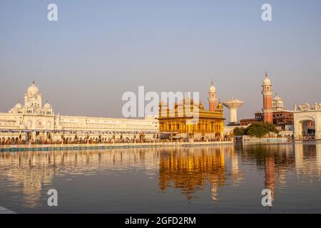 The Golden Temple (also known as Harmandir Sahib, lit. 'abode of God' or Darbār Sahib, meaning 'exalted court') is a gurdwara (place of assembly and w Stock Photo