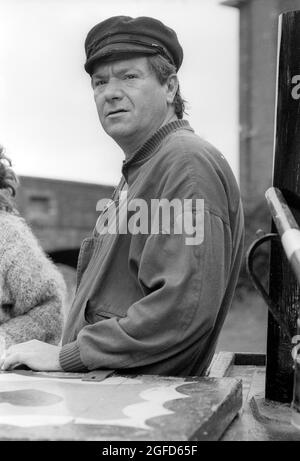 'Cap'n' Michael: actor Michael Elphick as BOON the leading character for the Central TV series BOON in 1985 takes time of from filming to enjoy the life on narrow boat canal craft as he learns to navigate the craft through the Birmingham canal system. Stock Photo