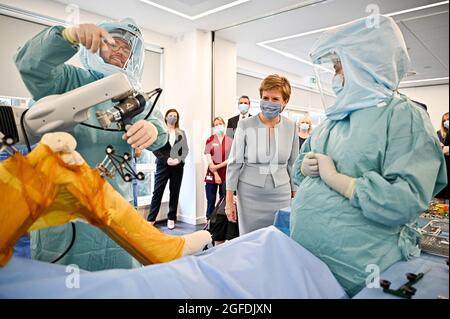 First Minister of Scotland Nicola Sturgeon during a visit to a mock theatre set up with innovative new medical equipment including robotic surgery devices for the launch of the NHS recovery plan at the Golden Jubilee National Hospital in Clydebank, near Glasgow. Picture date: Wednesday August 25, 2021.