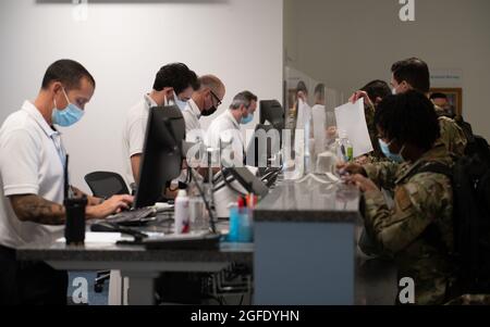 Airmen with the 48th Medical Group fill out paperwork at Royal Air Force Mildenhall, England, before deploying to Ramstein Air Base, Germany, to assist in Operation Allies Refuge Aug. 23, 2021. Mobilizing in less than 24 hours, 48th Fighter Wing personnel demonstrate the ability to provide support when needed to other wings as well as their allies and partners at a moment’s notice. (U.S. Air Force photo by Airman 1st Class Cedrique Oldaker) Stock Photo