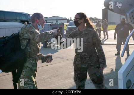 U.S. Air Force Chief Master Sgt. Jolynn Kari, 48th Medical Group superintendent, wishes Airmen luck as they board a KC-135 Stratotanker at Royal Air Force Mildenhall, England, to deploy to Ramstein Air Base, Germany, to assist in Operation Allies Refuge Aug. 23, 2021. While deployed to Ramstein, the 48th MDG Airmen will be augmenting the efforts of the 86th Medical Group personnel to ensure the health and safety of the Afghans housed on the installation. (U.S. Air Force photo by Airman 1st Class Cedrique Oldaker)