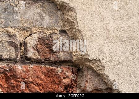 Close up of an old brick wall in Honfleur, France, for an abstract background texture. Stock Photo