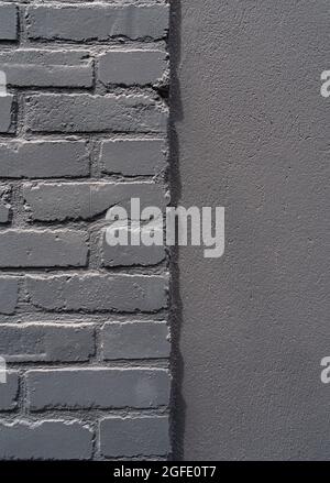 Close up of an old stone brick and concrete grey wall in Honfleur, France, for an abstract background texture. Stock Photo